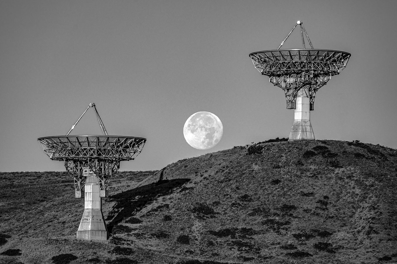 full moon with radio dish antennas